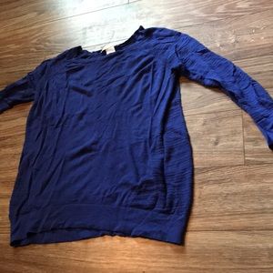 A blue knitted DESIGN history top.